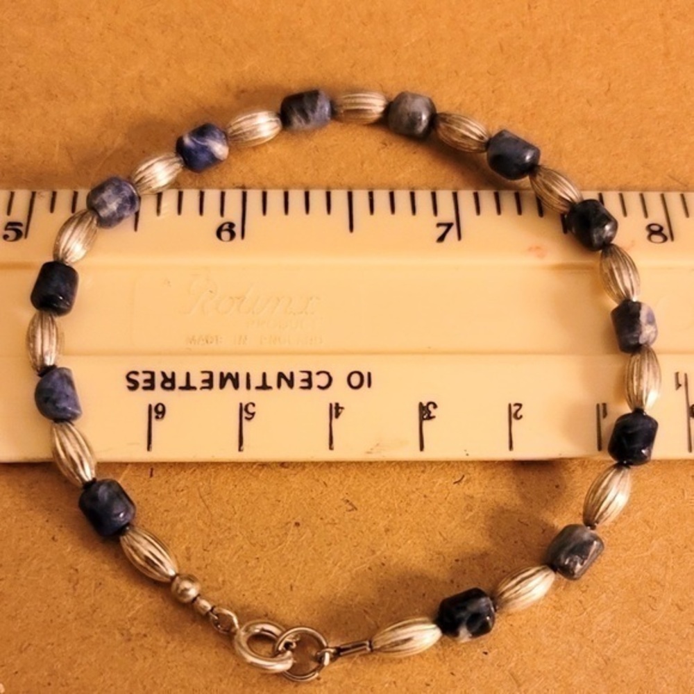 Silver tone and dark blue beaded bracelet
